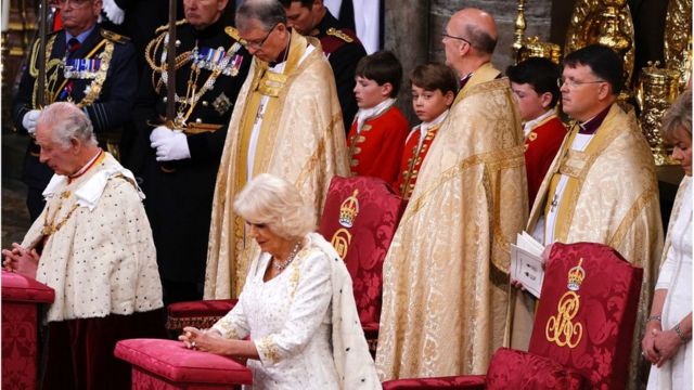 Prince George watches King Charles III during the coronation ceremony in Westminster Abbey