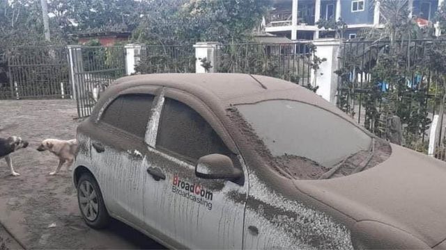A car covered in ash