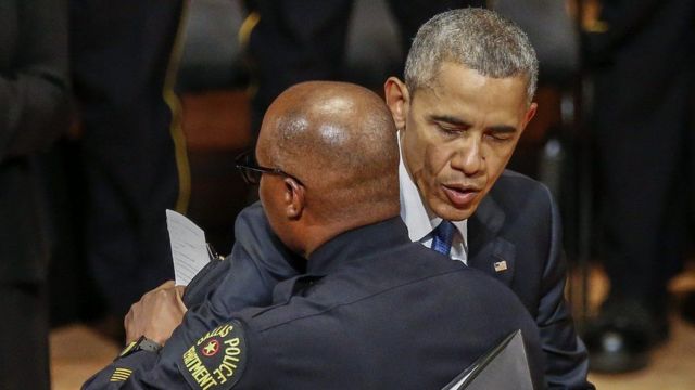 President Obama hugging police officer