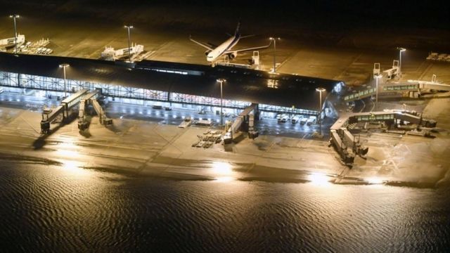 Runways were flooded at Kansai airport and its bridge to the mainland was damaged