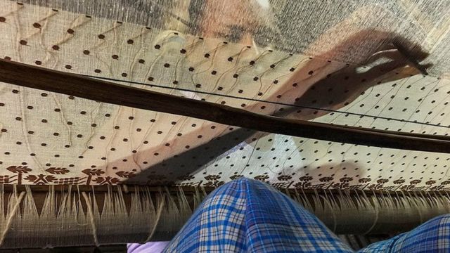 A weaver making muslin fabric