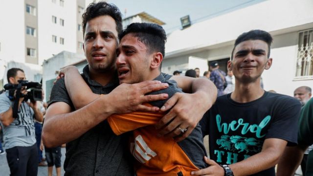 Several men mourning in Gaza