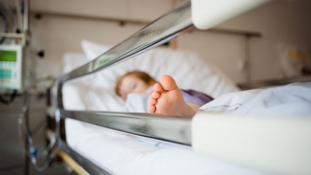 Little girl on a hospital bed