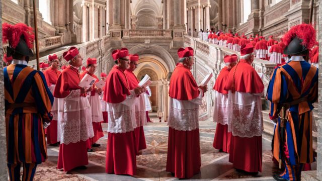 A scene from the film of cardinals lined up
