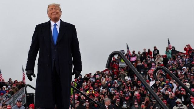 Trump addresses a rally in Lansing, Michigan