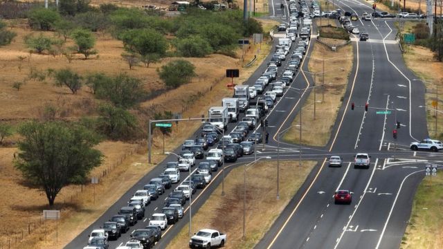 In an aerial view, cars back up for miles on the Honoapiilani highway as residents are allowed back into areas affected by the recent wildfire on August 11, 2023 in Wailuku, Hawaii.