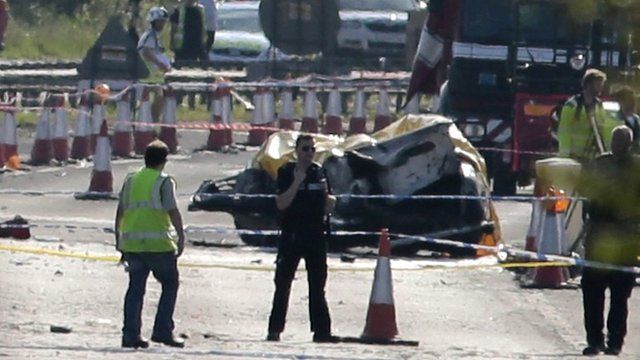 Emergency services attend the scene on the A27 after a plane crashed into cars on the major road during an aerial display at the Shoreham Airshow in West Sussex