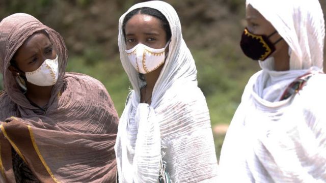 People wearing face masks as a precautionary measure against the coronavirus (Covid-19) come to Entoto Kidane Mehret Church as Ethiopian Orthodox Christians celebrate Filseta Day after the end of fasting for 15 days without consuming animal products in commemoration of Assumption of Mary in Addis Ababa, Ethiopia on August 22, 2020.