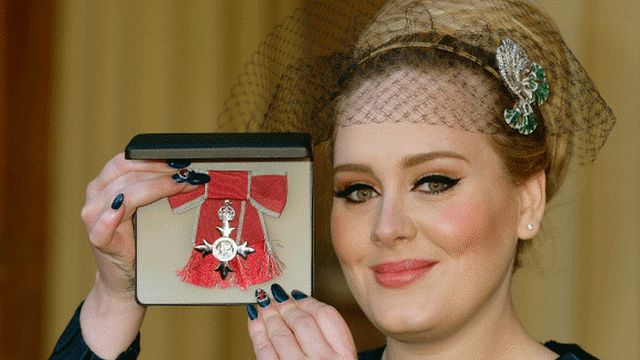Adele collecting a medal