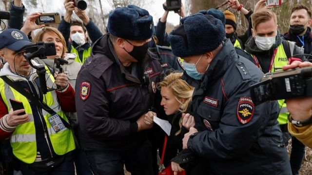 Navalny's personal doctor Anastasia Vasilyeva is held by police outside the prison