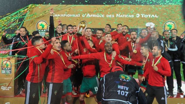 Morocco dey celebrate with dem trophy