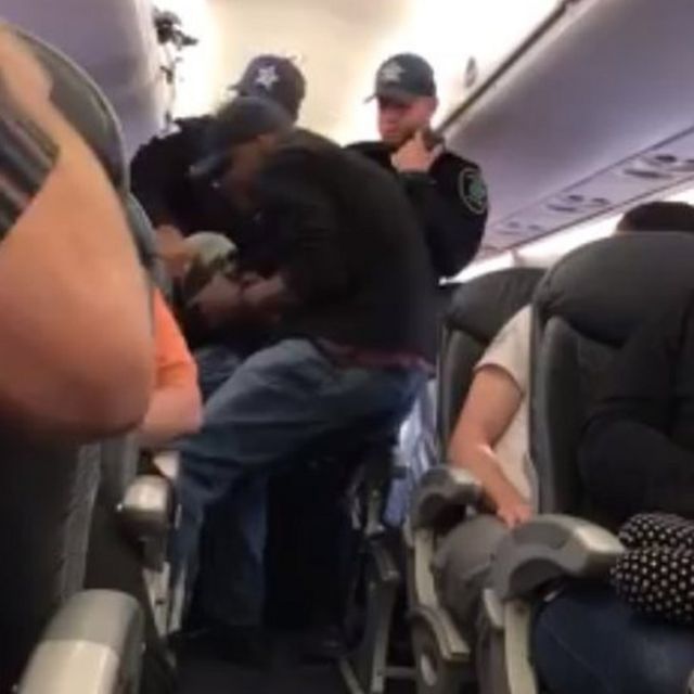 Man being shown pulled out of his seat