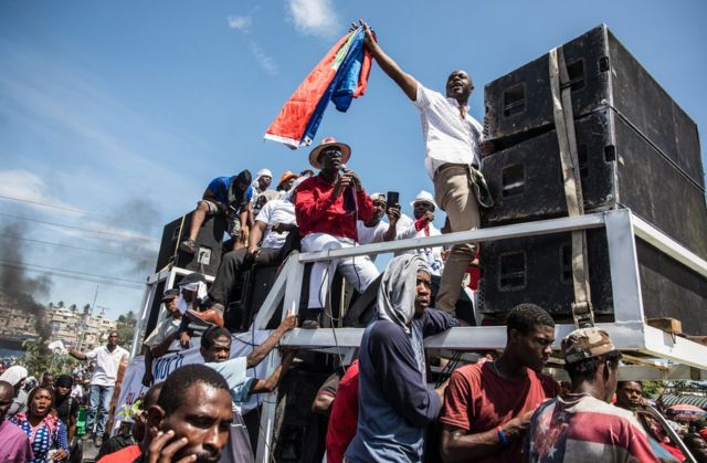 Protesters with loudspeakers in Haiti