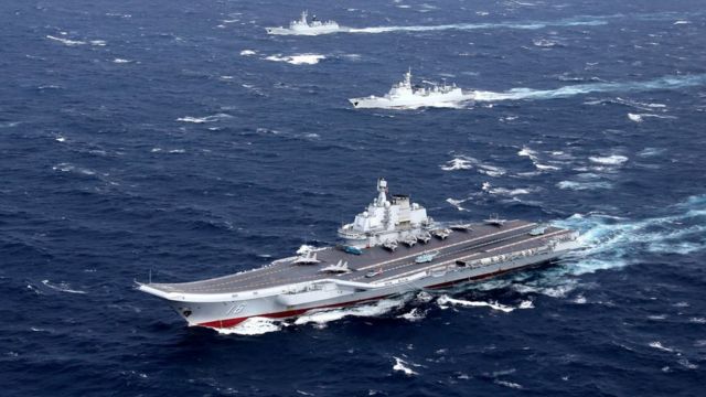 The Liaoning aircraft carrier with accompanying fleet conducts a drill in an area of South China Sea, in this undated photo taken in December 2016.
