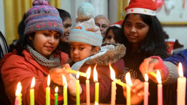Christian devotees light candles on Christmas Day at St.Paul Church in Amritsar