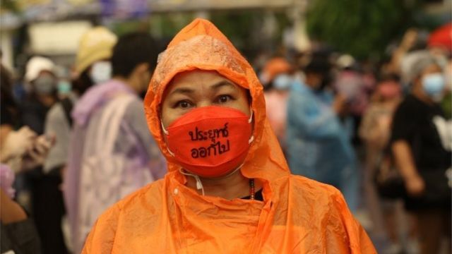 A anti-government protest wearing a protective face mask with "Prayut get out" message during they rally near the Government House in Bangkok, Thailand, 02 July 2021