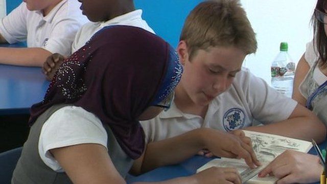 Pupils reading a book