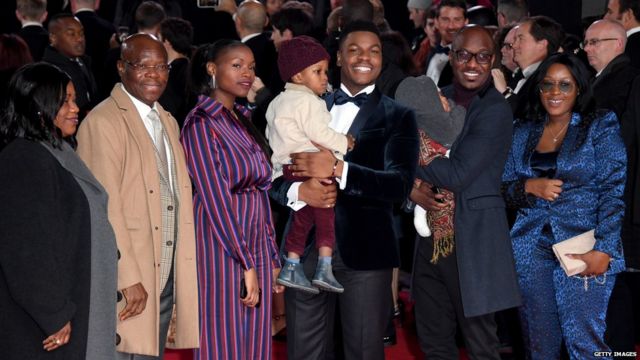 John Boyega and his family on the red carpet