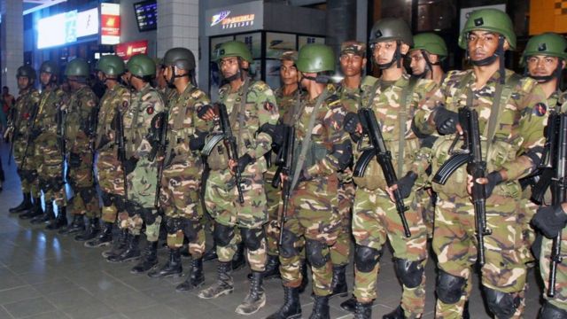 Bangladeshi security forces stand guard at the Shah Amanat International Airport in Chittagong, Bangladesh, 24 February 2019