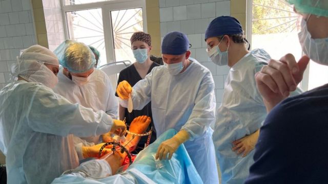 Dr. Yazigi performs surgery with a team of doctors