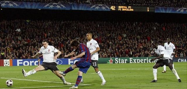 Lionel Messi scores his fourth goal against Arsenal