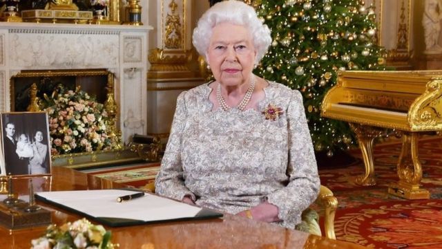 The Queen in the white drawing room of Buckingham Palace