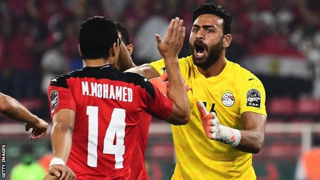 Gabaski (right) celebrates his penalty save with Egypt team mates