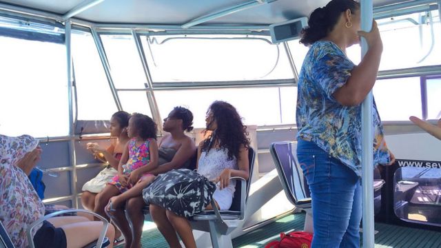 Tourists inside ferry boat.