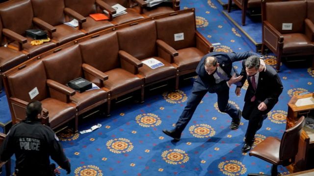 Congressmen are evacuated from the US House of Representatives.