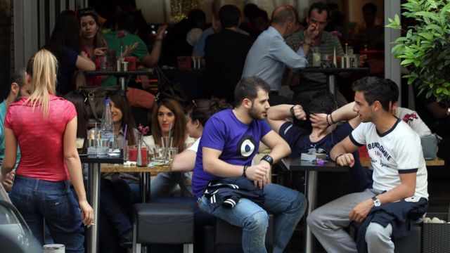 Young people sitting in a bar in Athens.