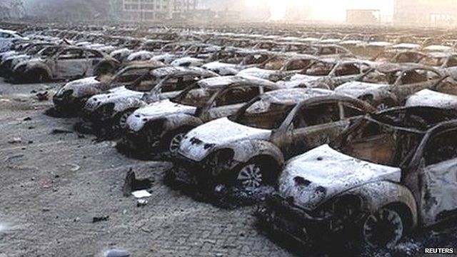 Damaged cars at the site of the blast in Tianjin, China