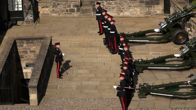 Soildiers participate in a gun salute for Britain's King Charles, following the passing of Britain's Queen Elizabeth
