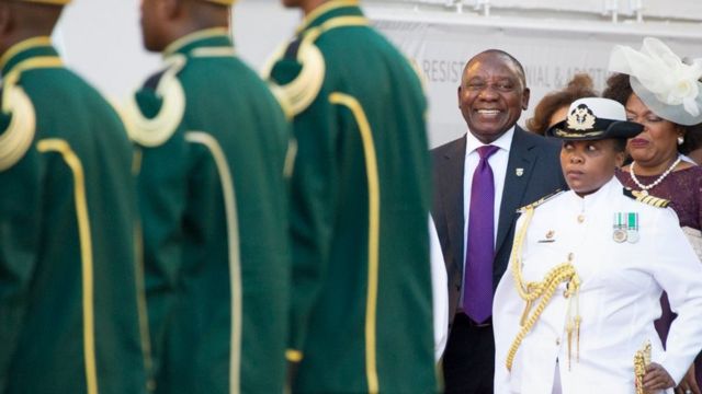 South Africa's newly-minted president Cyril Ramaphosa (centre) arrives to deliver his State of the National address at the Parliament in Cape Town, on February 16, 2018.