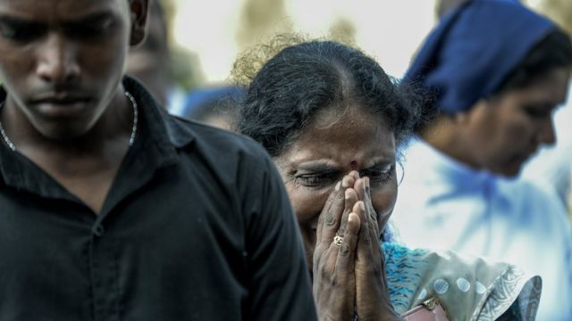 Relatives cry at the graveside during the funeral of a victim of the Easter Sunday Bombings at a local cemetery on April 24, 2019 in Colombo,