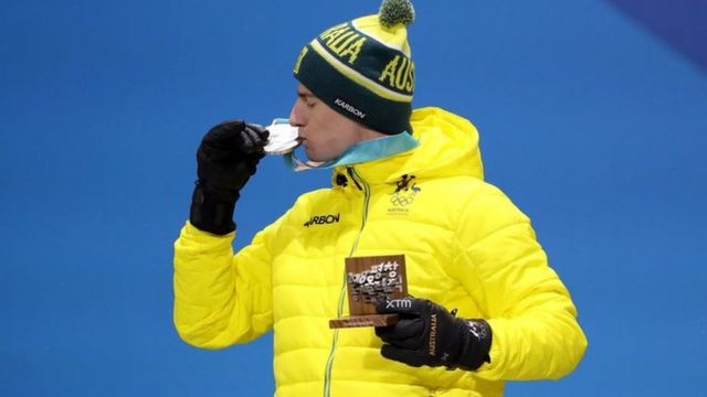 Australian freestyle skier Matt Graham celebrates winning a silver medal in the 2018 Winter Olympics