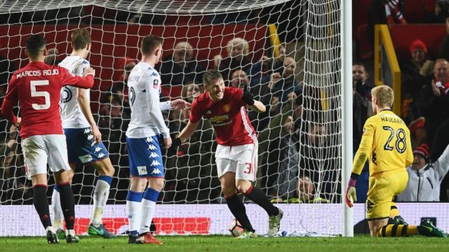 Les joueurs de Manchester United jubilent après un but marqué contre Wigan