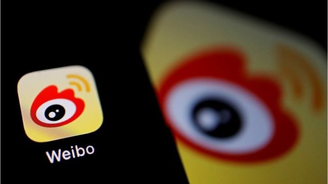 FILE PHOTO: The logo of Chinese social media app Weibo is seen on a mobile phone in this illustration picture taken December 7, 2021.