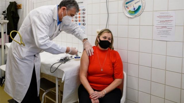 Woman receives the vaccine in Hungary.