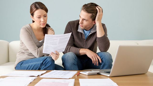 couple looking at invoices
