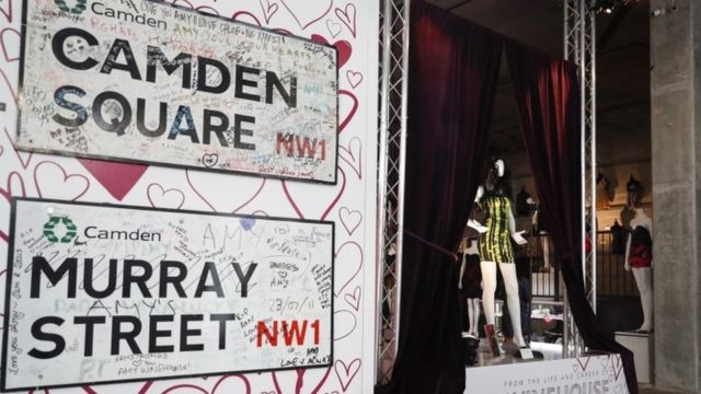 Metal street signs from Camden, London inscribed with notes from fans after the passing of British singer Amy Winehouse and a mini dress worn by Winehouse during her final concert performance in Belgrade