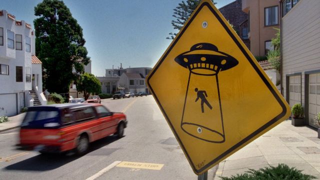 A sign in San Francisco shows an alien abduction