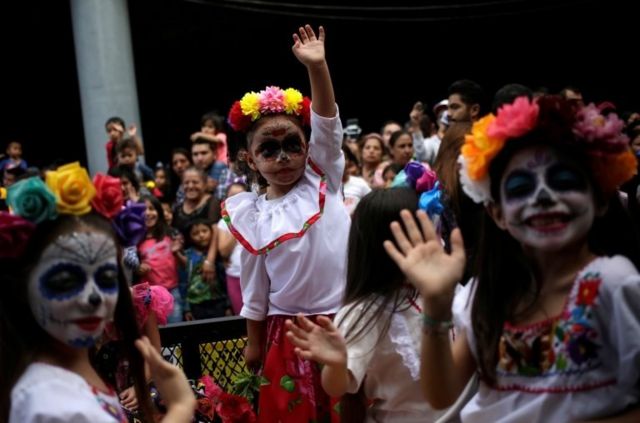 Young girls dressed as Catrina take part in a parade ahead of Day of the Dead in Monterrey, Mexico October 27, 2019