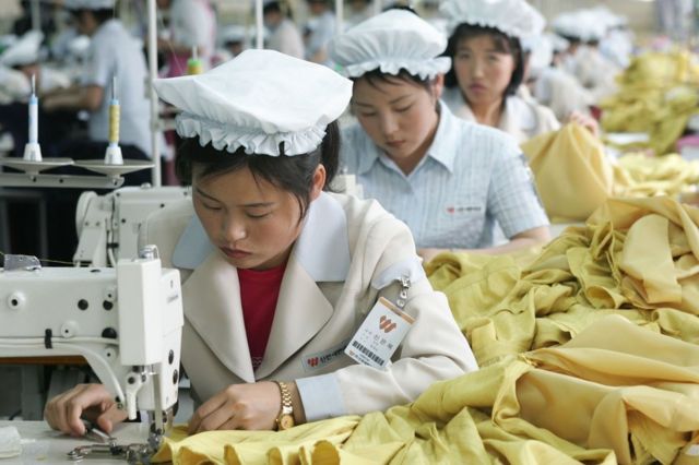 North Korean women work at the assembly line of the factory of South Korean textile company ShinWon at the Kaesong industrial complex on 22 May 2007 in Kaesong, North Korea
