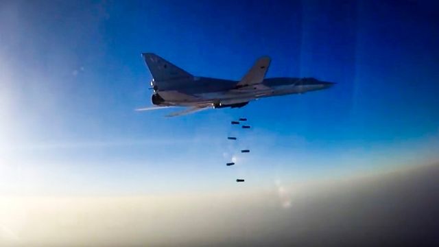 A still image, taken from video footage released by the Russian Defence Ministry on 16 August 2016, shows a Russian Tupolev Tu-22M3 long-range bomber based in Iran dropping bombs on an unknown location in Syria