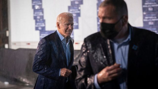 Biden was caught in the rain as he left the stage in Florida