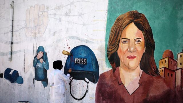 A mural showing a picture of Palestinian journalist Sherine Abu Aqleh