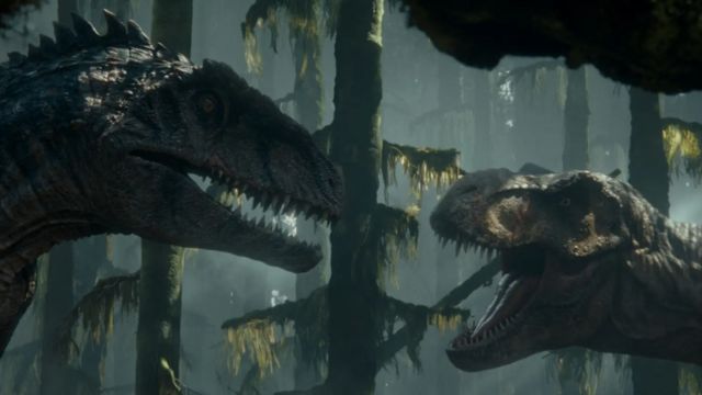 Cena de filme mostra um T. rex e um giganantossauro se enfrentando em uma floresta