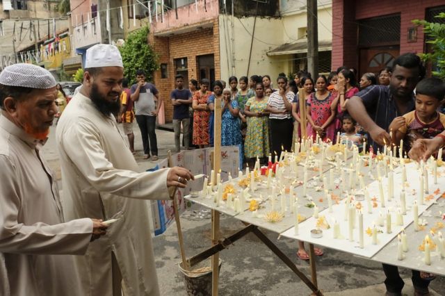 Sri Lankan Muslims light candles and offer prayers outside the St. Anthony"s Church where blast took place last Sunday Colombo, Sri Lanka, 28 April 2019.