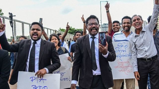 Lawyers and civil rights activists take part in a protest against the Prevention of Terrorism Act (PTA) law, which allows for the prolonged detention of suspects without trial, near the Presidential Secretariat in Colombo on October 10, 2022.