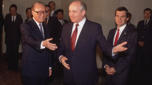 After 30 years of rupture between The Soviet Union and China, President Mikhail Gorbachev pays an official visit to Beijing, where he is greeted by Chinese Communist Party Secretary General Zhao Ziyang on the third day of his visit. Ziyang, who advocates dialogue with pro-democracy student demonstrators on Tiananmen Square during the visit, is later ousted from his post.